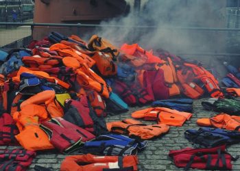 Why do migrants leave France and try to cross the English Channel?