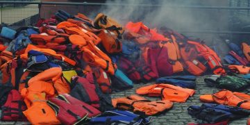 Why do migrants leave France and try to cross the English Channel?