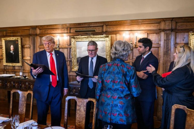 President Donald J. Trump and Prime Minister Keir Starmer review documents with aides during a working session at Chequers.