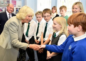 The Duchess of Cornwall meets school children as she visits Ballyhackamore Credit Union in Belfast, Northern Ireland, as the Prince of Wales and Camilla, attend a series of engagements in Northern Ireland following their two day visit in the Republic of Ireland.