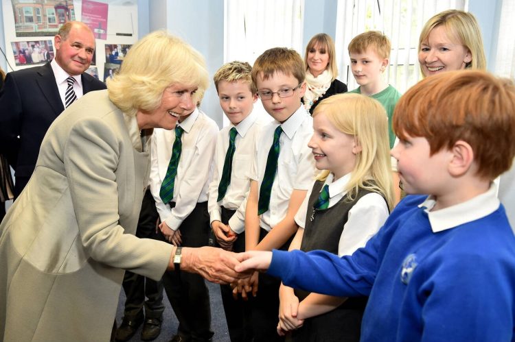 The Duchess of Cornwall meets school children as she visits Ballyhackamore Credit Union in Belfast, Northern Ireland, as the Prince of Wales and Camilla, attend a series of engagements in Northern Ireland following their two day visit in the Republic of Ireland.