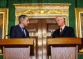 Northern Ireland Secretary Hilary Benn (right) and Tanaiste Simon Harris (left) speak to the media in the Throne Room at Hillsborough Castle, Belfast, following the publication of a new joint framework to deal with the legacy of the NI Troubles.