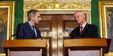 Northern Ireland Secretary Hilary Benn (right) and Tanaiste Simon Harris (left) speak to the media in the Throne Room at Hillsborough Castle, Belfast, following the publication of a new joint framework to deal with the legacy of the NI Troubles.